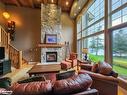 Sandfield 2 Week 10-3876 Muskoka Road 118, Port Carling, ON  - Indoor Photo Showing Living Room With Fireplace 