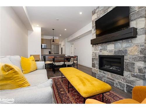 202-18 Beckwith Lane, The Blue Mountains, ON - Indoor Photo Showing Living Room With Fireplace