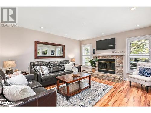 402 Mariners Way, Collingwood, ON - Indoor Photo Showing Living Room With Fireplace