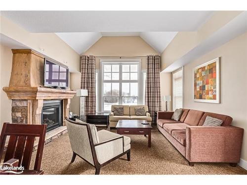 226-125 Fairway Court, The Blue Mountains, ON - Indoor Photo Showing Living Room With Fireplace