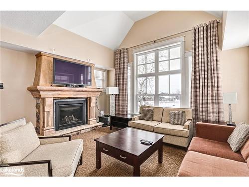 226-125 Fairway Court, The Blue Mountains, ON - Indoor Photo Showing Living Room With Fireplace