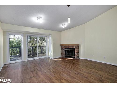 34-5 Harbour Street East, Collingwood, ON - Indoor Photo Showing Living Room With Fireplace