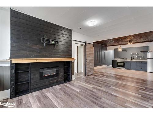 5-43 Manitoba Street, Bracebridge, ON - Indoor Photo Showing Other Room With Fireplace