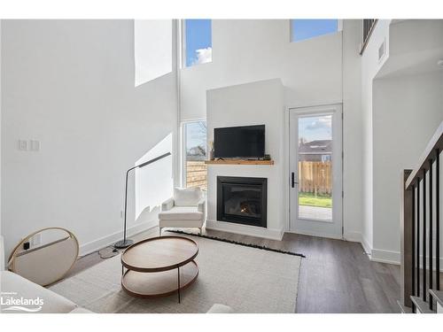 9-19B West Street, Kawartha Lakes, ON - Indoor Photo Showing Living Room With Fireplace