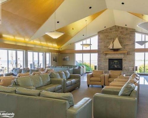 550 Mariners Way, Collingwood, ON - Indoor Photo Showing Living Room With Fireplace