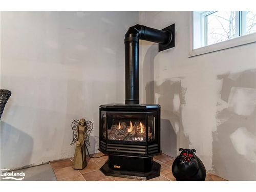 15 Mundy Avenue, Tiny, ON - Indoor Photo Showing Other Room With Fireplace