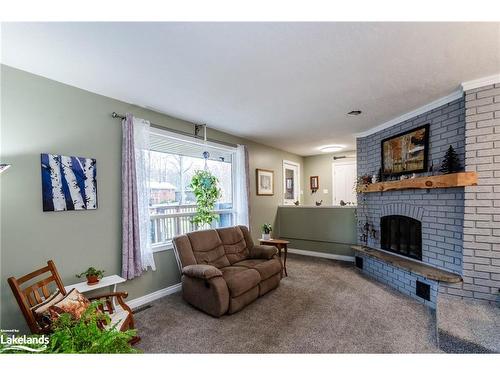 15 Mundy Avenue, Tiny, ON - Indoor Photo Showing Living Room With Fireplace