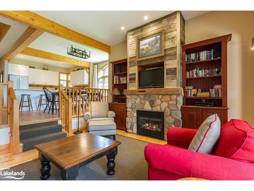 8, Fixed W-1111 Dwight Beach Road, Lake Of Bays, ON - Indoor Photo Showing Living Room With Fireplace