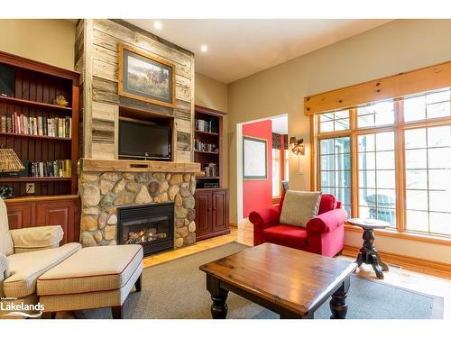 8, Fixed W-1111 Dwight Beach Road, Lake Of Bays, ON - Indoor Photo Showing Living Room With Fireplace