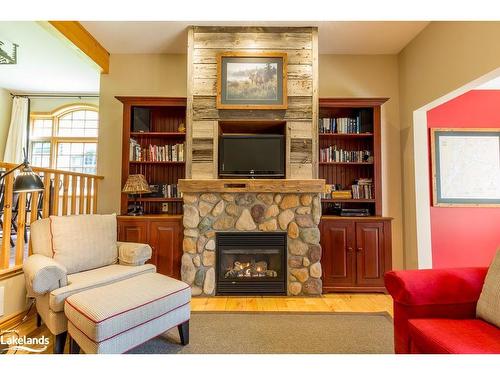 8, Fixed W-1111 Dwight Beach Road, Lake Of Bays, ON - Indoor Photo Showing Living Room With Fireplace