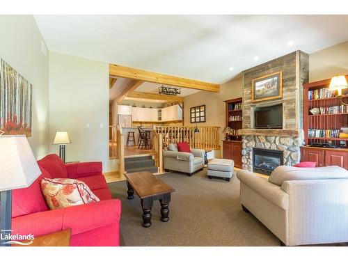 8, Fixed W-1111 Dwight Beach Road, Lake Of Bays, ON - Indoor Photo Showing Living Room With Fireplace