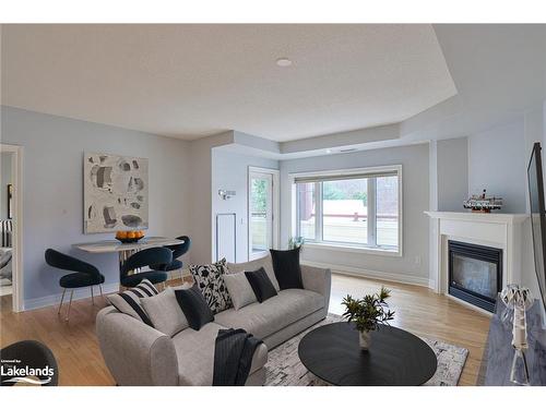 208-110 Steamship Bay Road, Gravenhurst, ON - Indoor Photo Showing Living Room With Fireplace