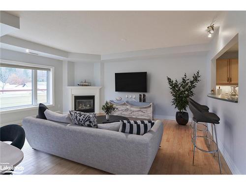 208-110 Steamship Bay Road, Gravenhurst, ON - Indoor Photo Showing Living Room With Fireplace