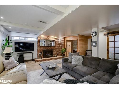 61 Woodland Drive N, Bracebridge, ON - Indoor Photo Showing Living Room With Fireplace