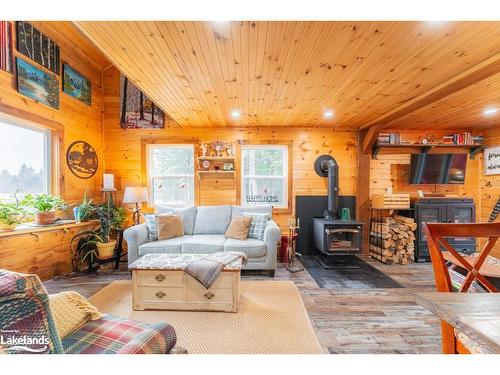 15-16-93 Rye Road, South River, ON - Indoor Photo Showing Living Room With Fireplace