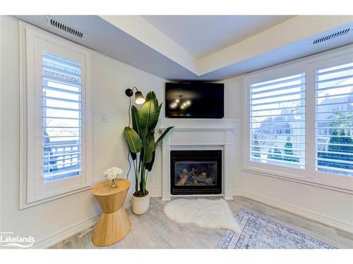 2C-194 River Road E, Wasaga Beach, ON - Indoor Photo Showing Living Room With Fireplace