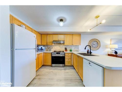 2C-194 River Road E, Wasaga Beach, ON - Indoor Photo Showing Kitchen With Double Sink