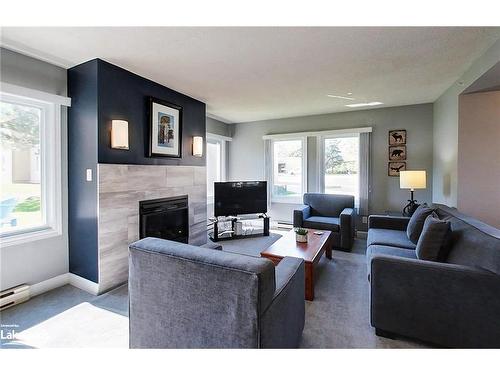 107-169 Jozo Weider Boulevard, The Blue Mountains, ON - Indoor Photo Showing Living Room With Fireplace