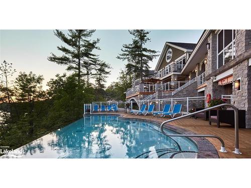 4-1869 Muskoka District Road 118 West, Muskoka Lakes, ON - Outdoor With In Ground Pool