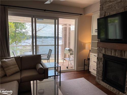 4-1869 Muskoka District Road 118 West, Muskoka Lakes, ON - Indoor Photo Showing Living Room With Fireplace