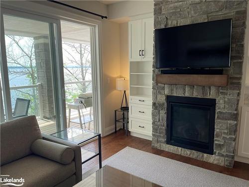 4-1869 Muskoka District Road 118 West, Muskoka Lakes, ON - Indoor Photo Showing Living Room With Fireplace