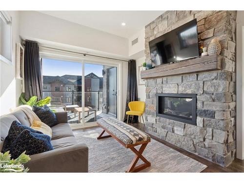 301-12 Beckwith Lane, The Blue Mountains, ON - Indoor Photo Showing Living Room With Fireplace