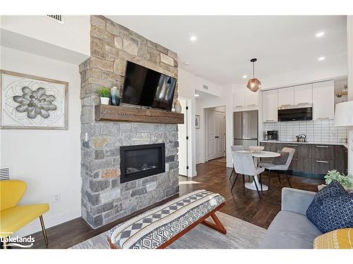 301-12 Beckwith Lane, The Blue Mountains, ON - Indoor Photo Showing Living Room With Fireplace