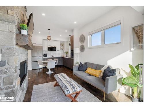 301-12 Beckwith Lane, The Blue Mountains, ON - Indoor Photo Showing Living Room With Fireplace