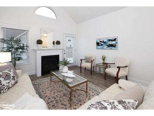 4 Sutton Lane, Collingwood, ON - Indoor Photo Showing Living Room With Fireplace