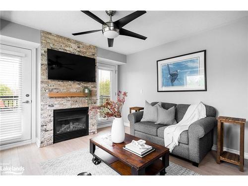 201-10 Brandy Lane Drive, Collingwood, ON - Indoor Photo Showing Living Room With Fireplace