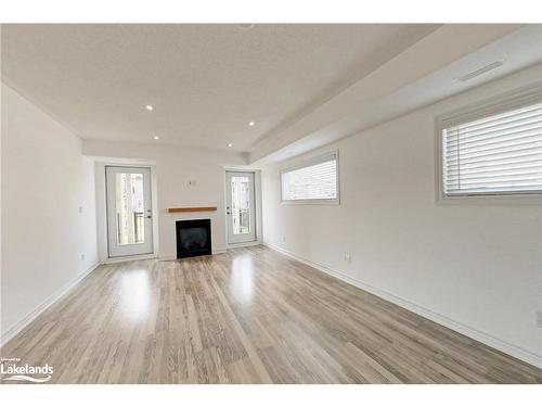 208-2 Cove Court, Collingwood, ON - Indoor Photo Showing Living Room With Fireplace