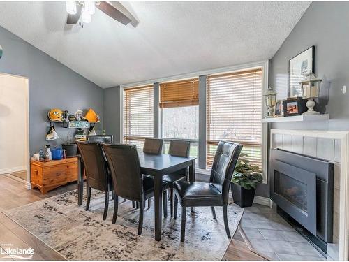 1012 Parasol Drive, Algonquin Highlands, ON - Indoor Photo Showing Dining Room With Fireplace