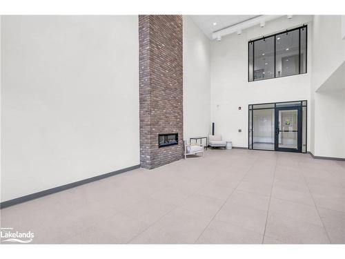 309-121 Mary Street, Clearview, ON - Indoor Photo Showing Other Room With Fireplace