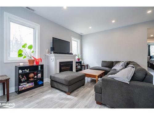 10 Elm Drive, Wasaga Beach, ON - Indoor Photo Showing Living Room With Fireplace