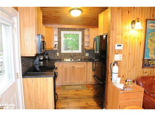 71 Earls Road, Mactier, ON - Indoor Photo Showing Kitchen With Double Sink