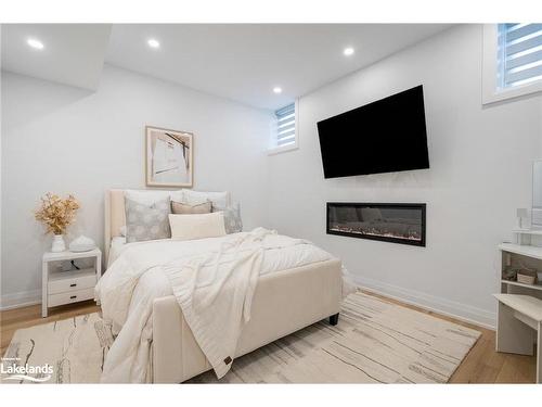 103 Springside Crescent, The Blue Mountains, ON - Indoor Photo Showing Bedroom With Fireplace