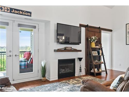 302-10 Brandy Lane Drive, Collingwood, ON - Indoor Photo Showing Living Room With Fireplace