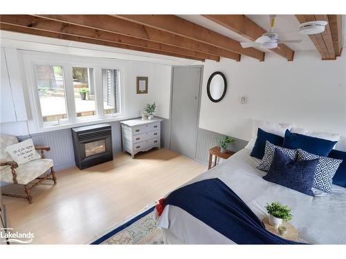 10 Kellington Point Road, Seguin, ON - Indoor Photo Showing Bedroom With Fireplace