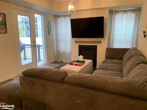 102-4 Cove Court, Collingwood, ON - Indoor Photo Showing Living Room With Fireplace