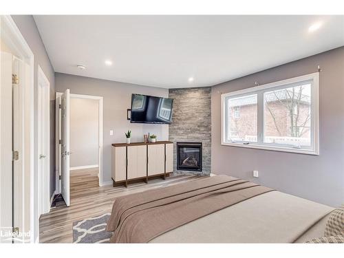 4 Burd Street, Parry Sound, ON - Indoor Photo Showing Bedroom With Fireplace