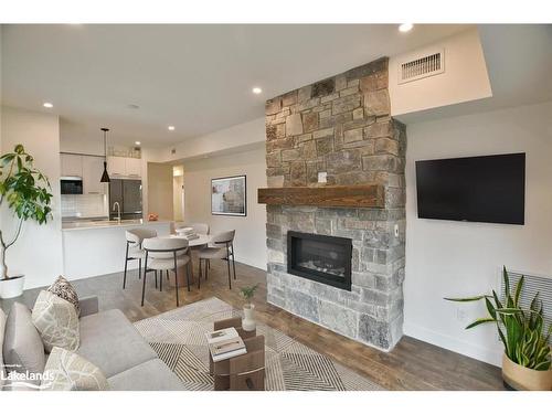 207-11 Beckwith Lane, The Blue Mountains, ON - Indoor Photo Showing Living Room With Fireplace