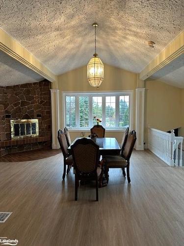 252 Swiss Meadows Boulevard, Ravenna, ON - Indoor Photo Showing Dining Room With Fireplace