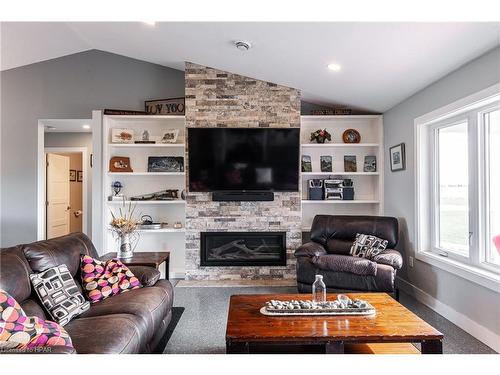 33836 Sunset Cove Road, Zurich, ON - Indoor Photo Showing Living Room With Fireplace