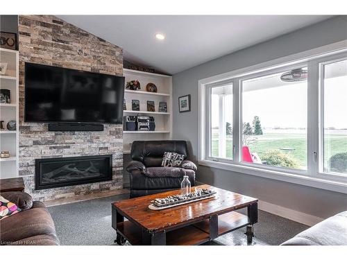 33836 Sunset Cove Road, Zurich, ON - Indoor Photo Showing Living Room With Fireplace