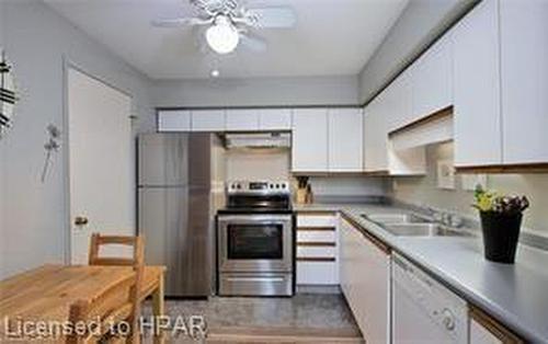 303-50 Campbell Court, Stratford, ON - Indoor Photo Showing Kitchen With Double Sink