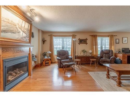 2853 Road 164, Mitchell, ON - Indoor Photo Showing Living Room With Fireplace
