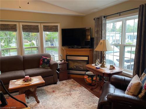 54 Cherokee Lane, Meneset, ON - Indoor Photo Showing Living Room With Fireplace