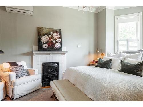 94 Hibernia Street, Stratford, ON - Indoor Photo Showing Bedroom With Fireplace