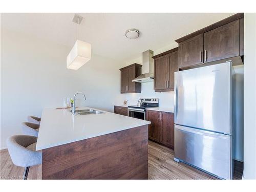 110-3025 Singleton Avenue, London, ON - Indoor Photo Showing Kitchen With Stainless Steel Kitchen With Double Sink