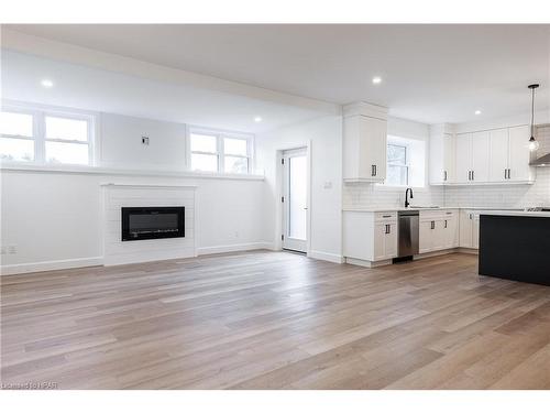 1-74 Church Street, Stratford, ON - Indoor Photo Showing Kitchen With Fireplace With Upgraded Kitchen